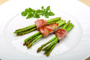 Grilled asparagus with bacon, basil and sesame