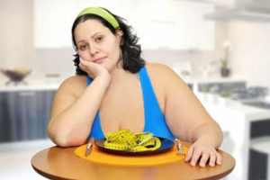 weight loss woman with plate of food Bariatric Center Kansas City